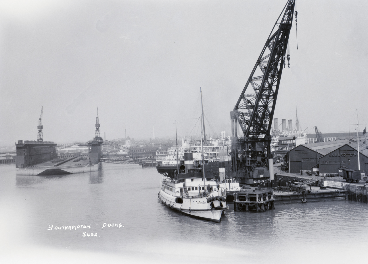 P95226; The passenger tender Greetings (1914) alongside Berth 48 in Southampton docks, Hampshire.